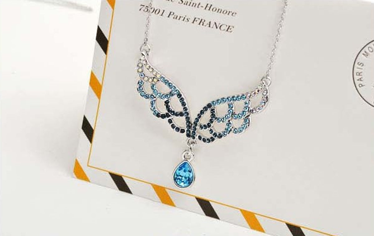 925 Sterling Silver Coated Angel Wings Pendant Necklace with Paved Stones and Teardrop CZ Crystal - Turquoise Blue