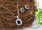 925 Sterling Silver Coated Oval Crystal Flower Pendant Necklace Adorned with White Stones - Sapphire Blue