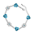 Sterling Silver Coated Chain Bracelet featuring 4 Sea Blue Heart Stones and 3 Flower Elements with Crystals